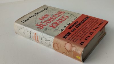 Tweedehands boek: Der Jüdische Krieg van auteur Lion Feuchtwanger - Hardcover met stofomslagen wikkelstrook. Ex Libris 1e blz vh boek. stof omsslag en wikkelstrook vertonen gebruikerssporen. Goede staat boek