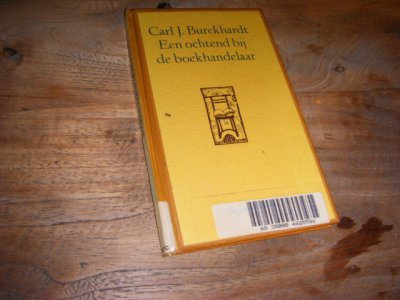 Tweedehands boek: Een ochtend bij de boekhandelaar van auteur Carl Jacob Burckhardt, J.G. Gaarlandt - Geplastificeerd ex-bibliotheekexemplaar met stempel 'afgeschreven' voorin.