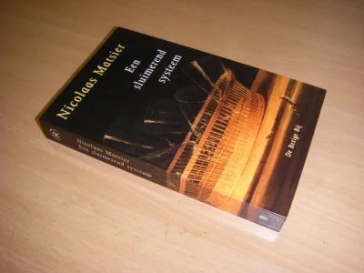 Tweedehands boek: Een sluimerend systeem van auteur Nicolaas Matsier  - Paperback, in nieuwstaat