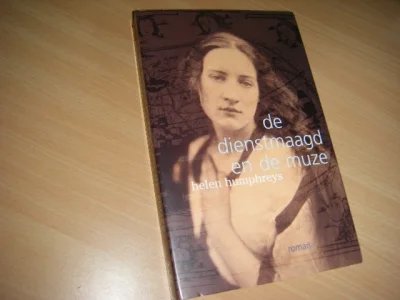 Boek met de titel: De dienstmaagd en de muze