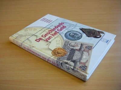 Boek met de titel: De Geschiedenis van het Geld, verzamelen van munten, penningen en bankbiljetten