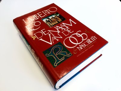 Boek met de titel: De naam van de roos & Naschrift