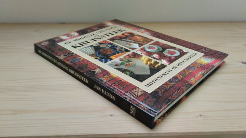 Tweedehands boek: De mooiste creaties in kruissteek van auteur Jan Eaton, Miep Rijsbergen, Mireille Vroege - Hardcover, als nieuw