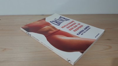 Boek met de titel: De crunch, revolutionaire oefeningen voor buik en rugspieren