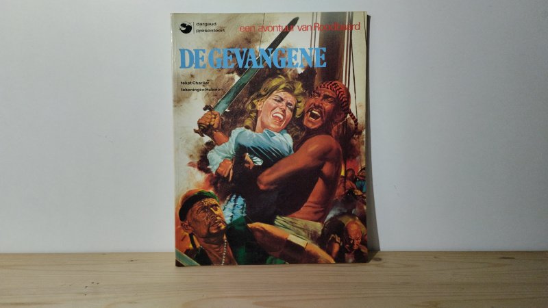 Tweedehands boek: Roodbaard, de gevangene van auteur Hubinon - Softcover, gelezen. Gebruikerssporen aan de kaft. Kaft en pagina's verkleurd. Stempelnaam binnenkant kaft.