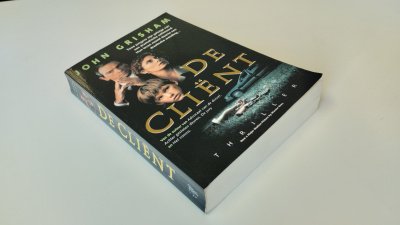 Boek met de titel: De Cliënt