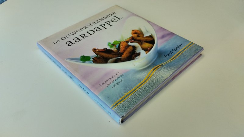 Tweedehands boek: De onweerstaanbare aardappel van auteur Paul Gayler - In goede staat. Nederlandstalige hardcover met stofomslag. Lichte gebruikerssporen aan de stofomslag. Pagina's iets verschoten van kleur, maar onbeschreven en netjes.