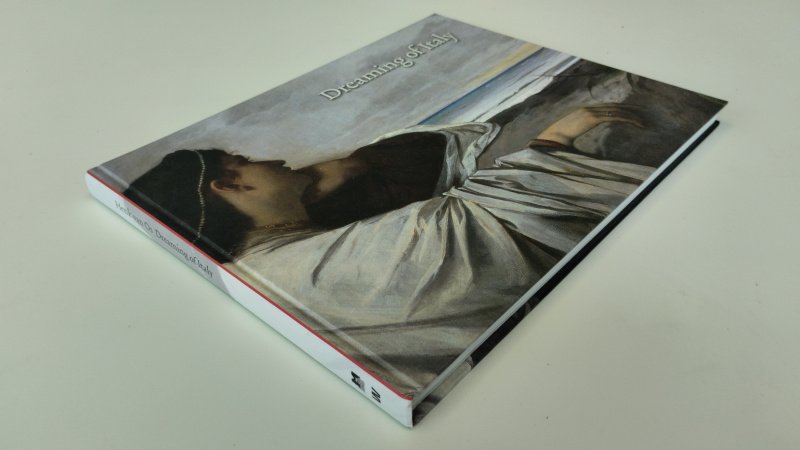 Tweedehands boek: Dreaming of Italy van auteur Henk van Os - Engelstalige hardcover in goede gebruikte staat. De kaft vertoont lichte, normale gebruikssporen. Het wit van de pagina's is licht verkleurd, maar het boek oogt over het geheel verzorgd. Ex Libris reliëfstempel voorin.