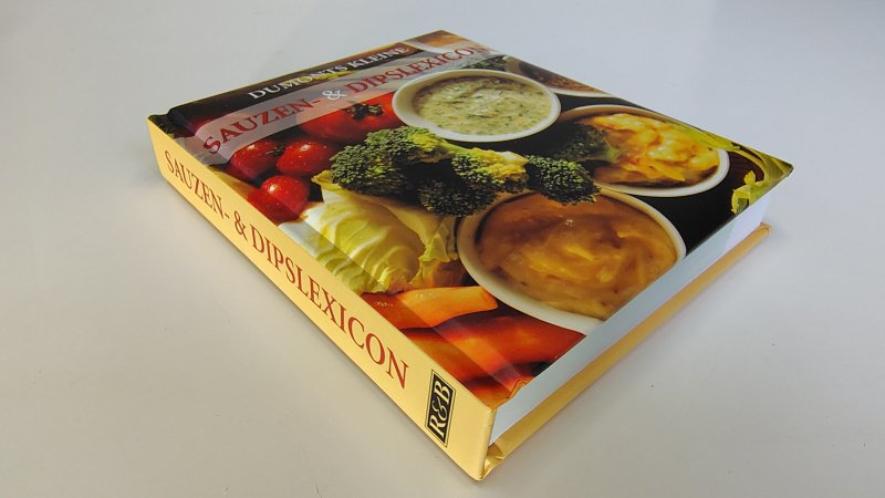 Tweedehands boek: Dumonts kleine sauzen & dips lexicon van auteur Kristiane Müller Urban - Zachte hardcover, oogt als nieuw. Minimale verkleuring witte bladzijdes, verder onbeschreven en netjes.