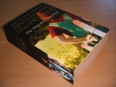 Tweedehands boek: The Way the Crow Flies van auteur Ann-Marie MacDonald - Paperback, creases in spine, traces of use, in reasonable condition.