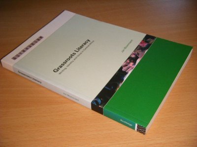 Tweedehands boek: Grassroots Literacy. van auteur Jan Blommaert - Paperback, in excellent condition. With pictures.